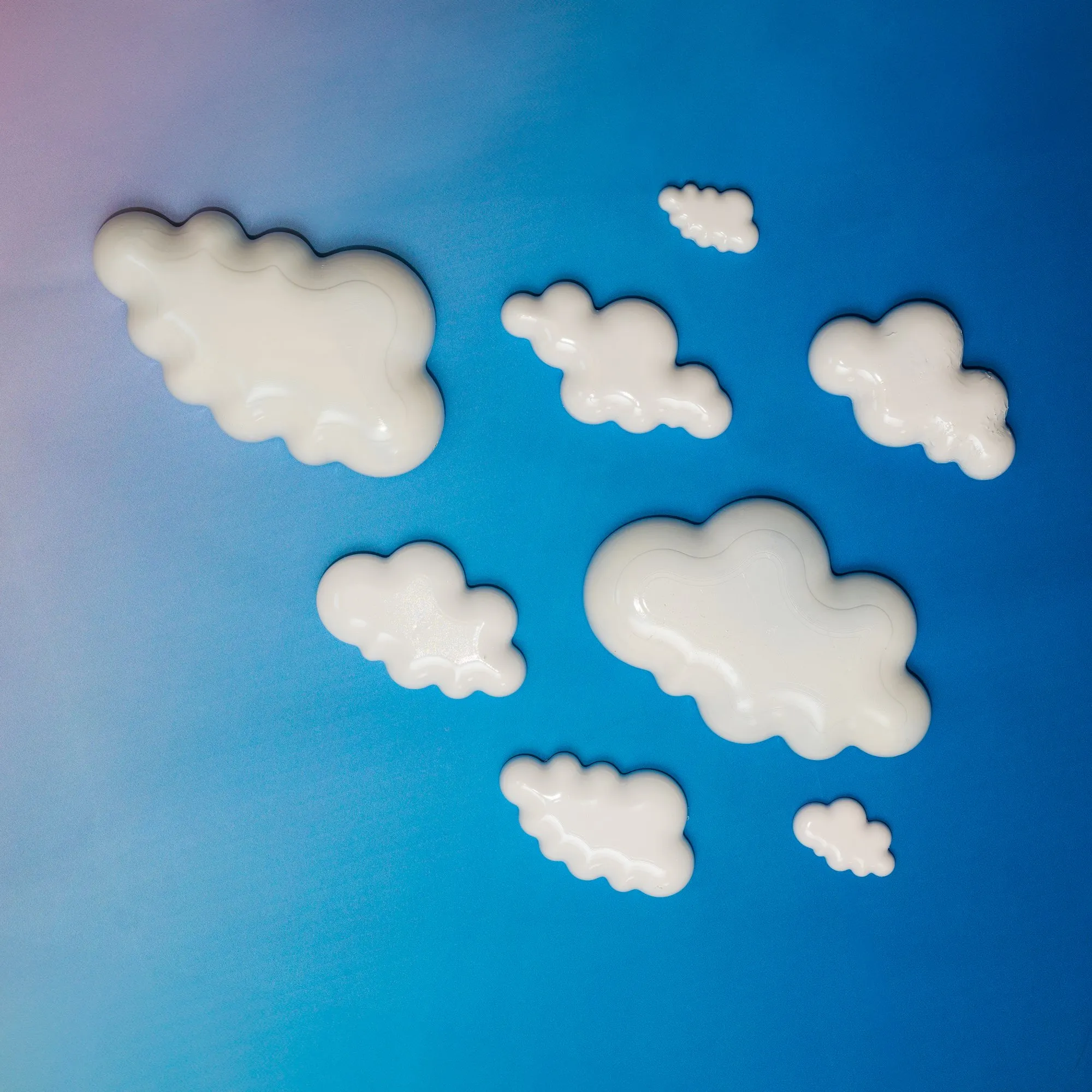 Cloud No. 9 for Miss Bugs: glossy UV resin clouds laid out on a blue backdrop