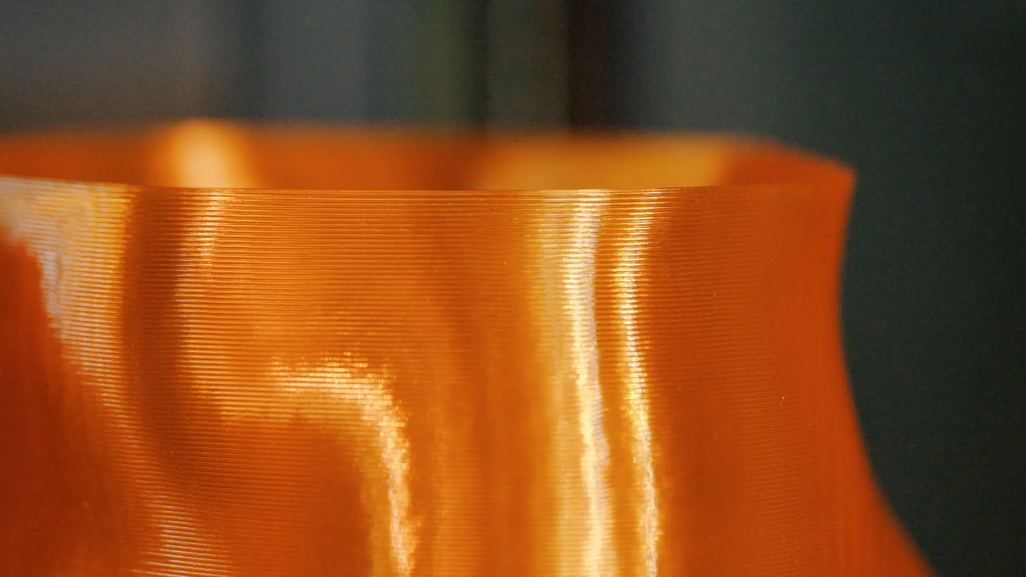 Close-up of the layer lines on an orange Peski vase